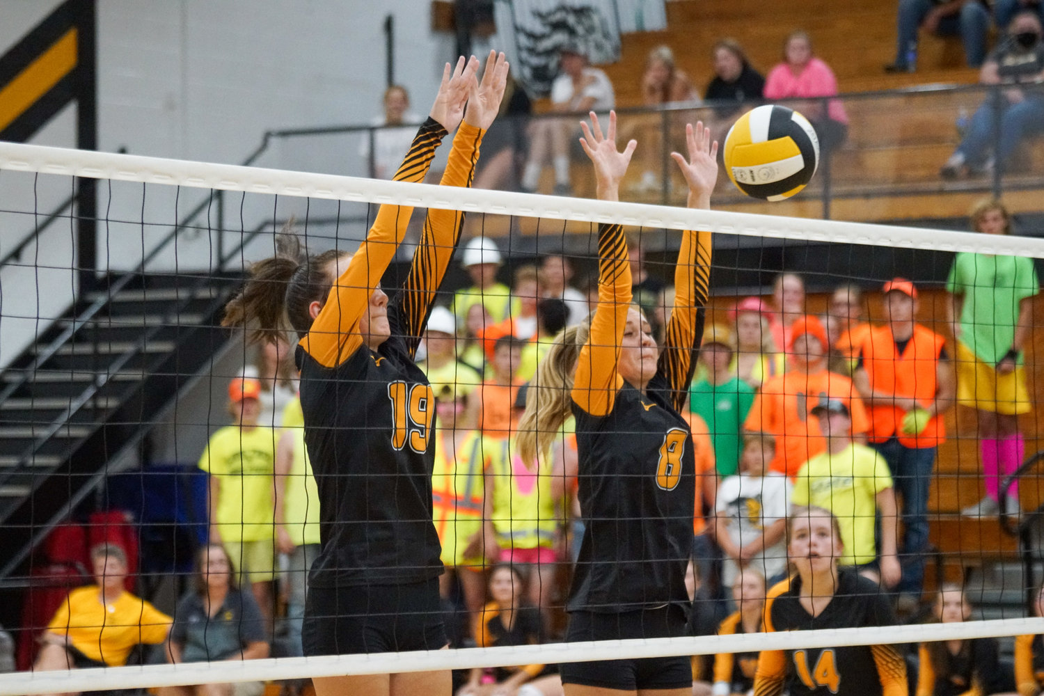 Avery Morarie and Rylee Shield attempt to block a Pekin attack during Thursday’s game.
